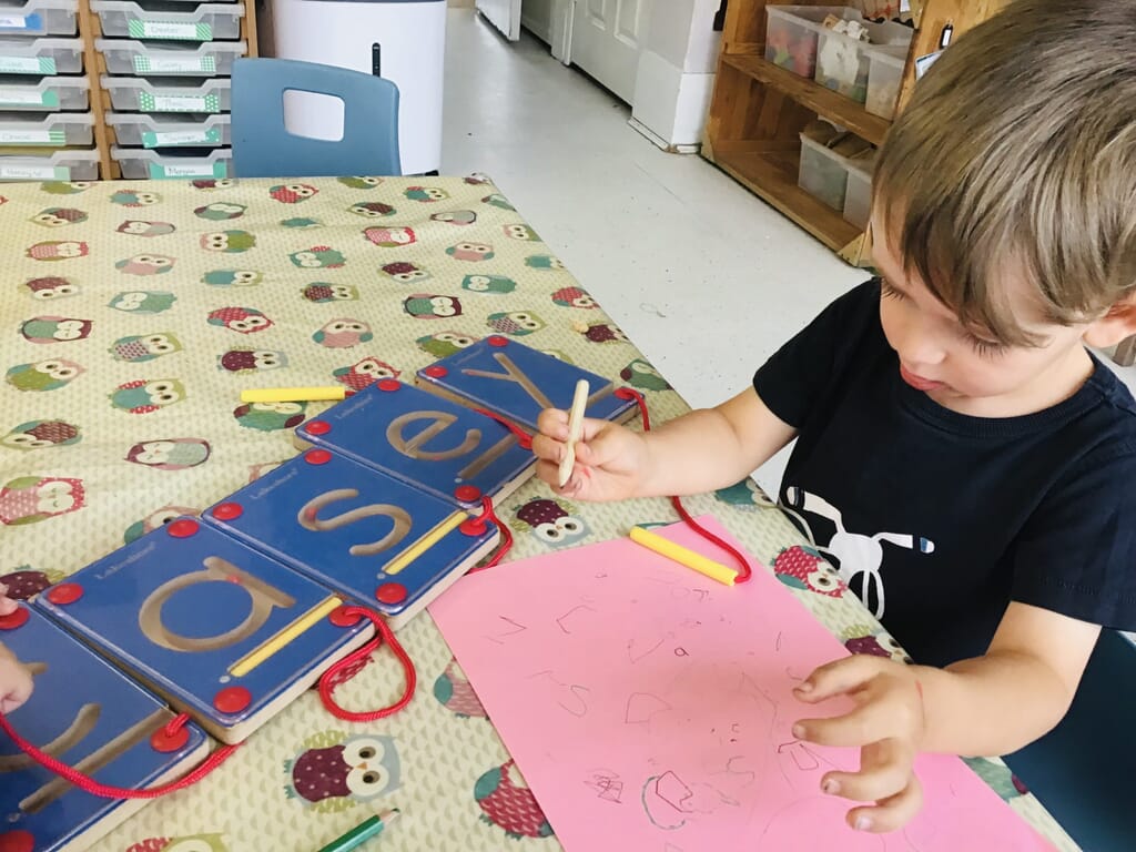 Nursery child learning the alphabet