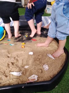 Nursery children playing in the sand