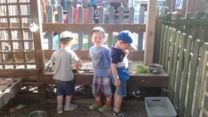 Nursery children playing outdoors