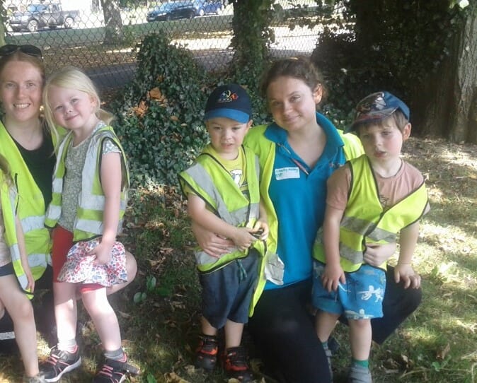 Staff with nursery children outdoors
