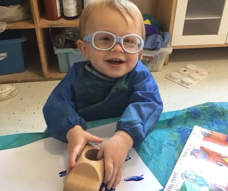 Nursery child painting with a wooden car