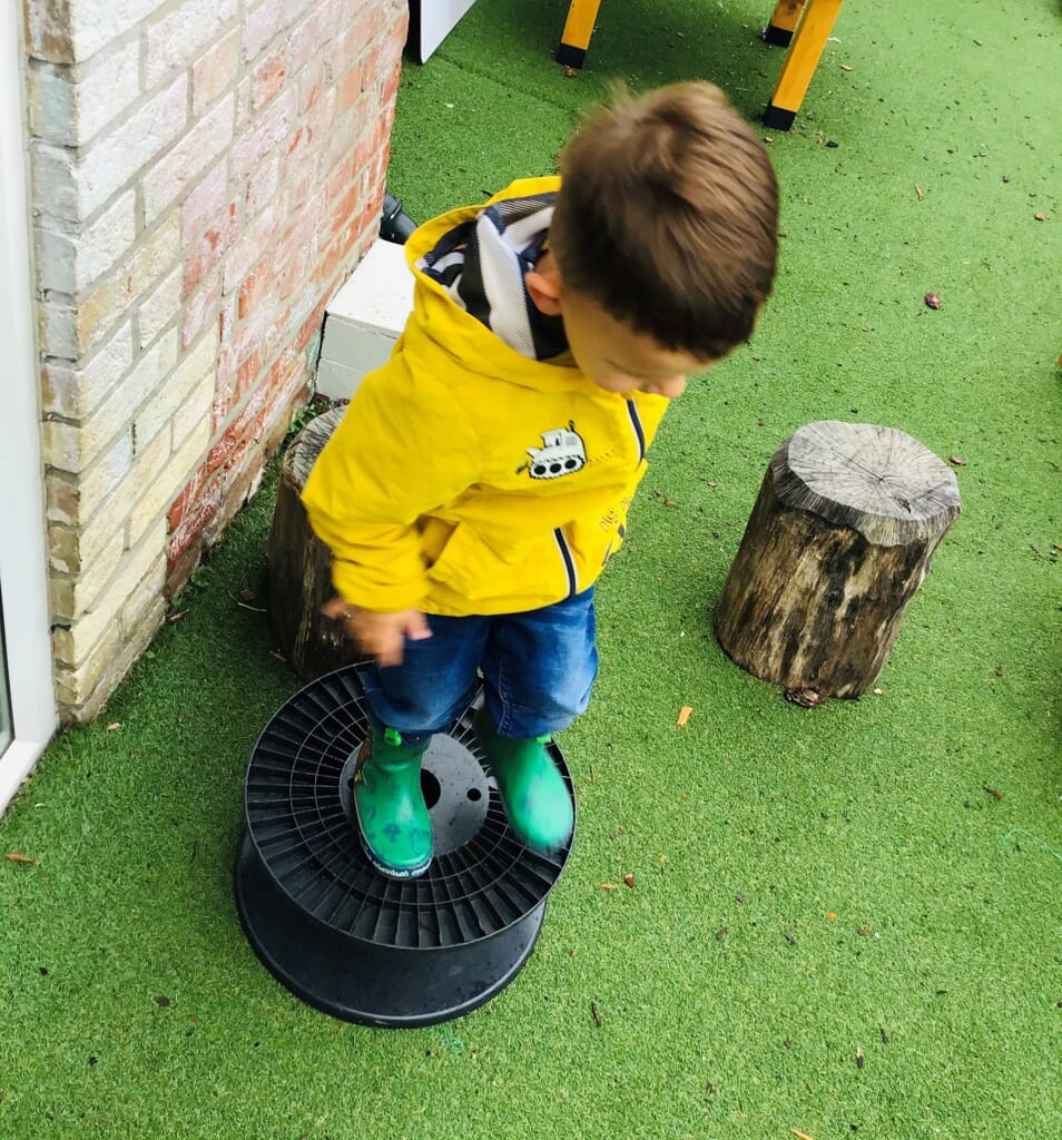 Nursery child playing outdoors