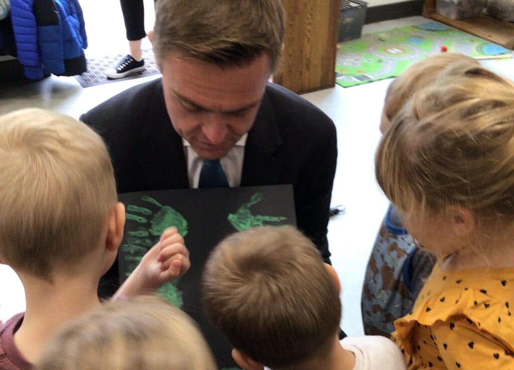 Children showing MP, Will Quince, their painting