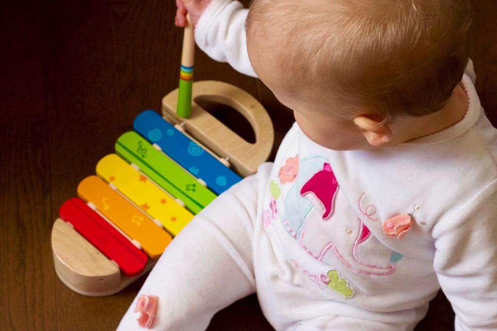 Nursery child playing the xylophone