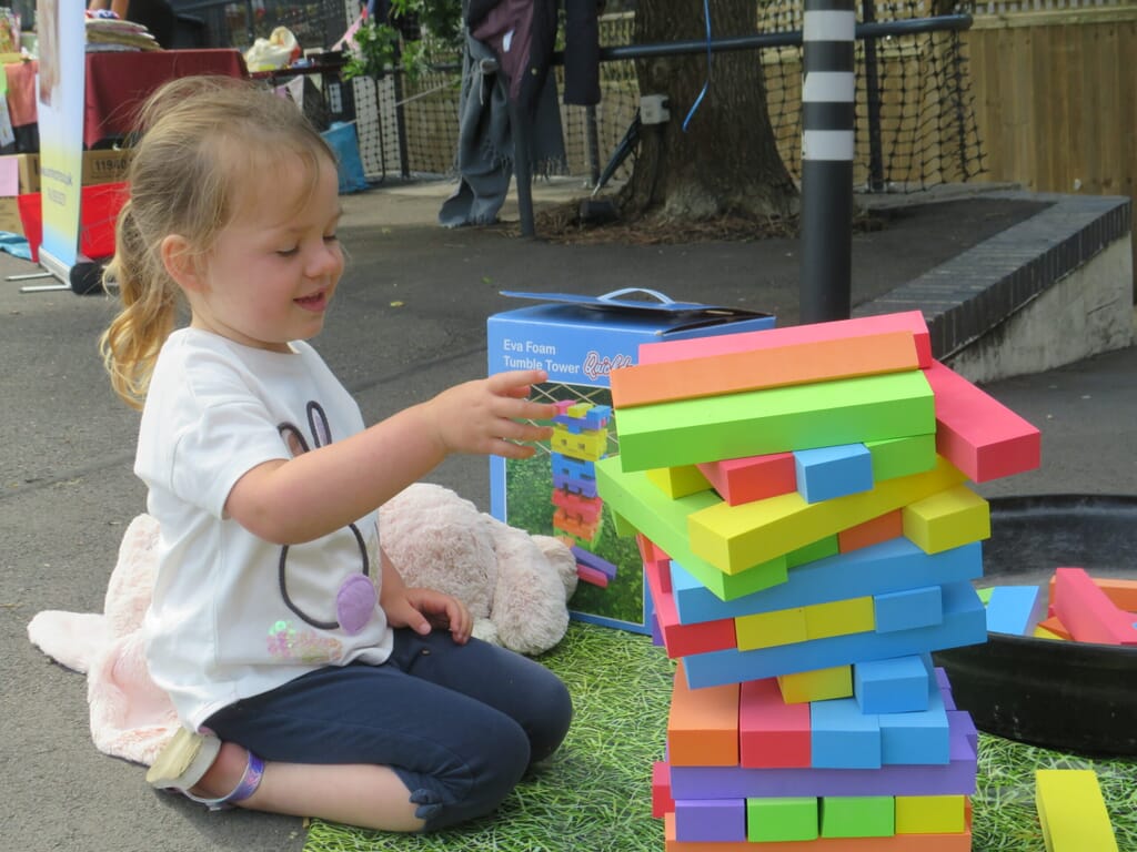 Nursery child playing with blocks