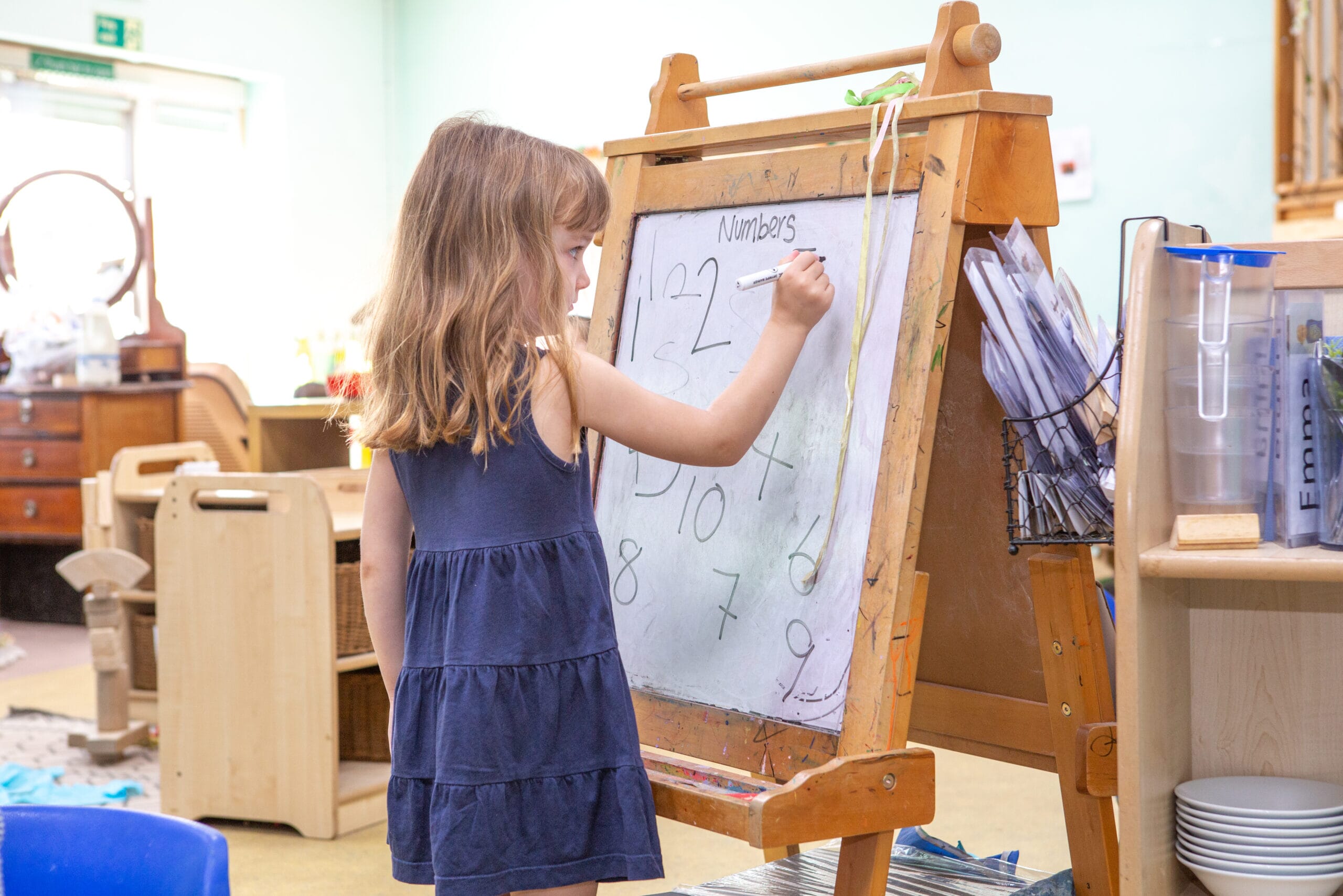Child writing on board