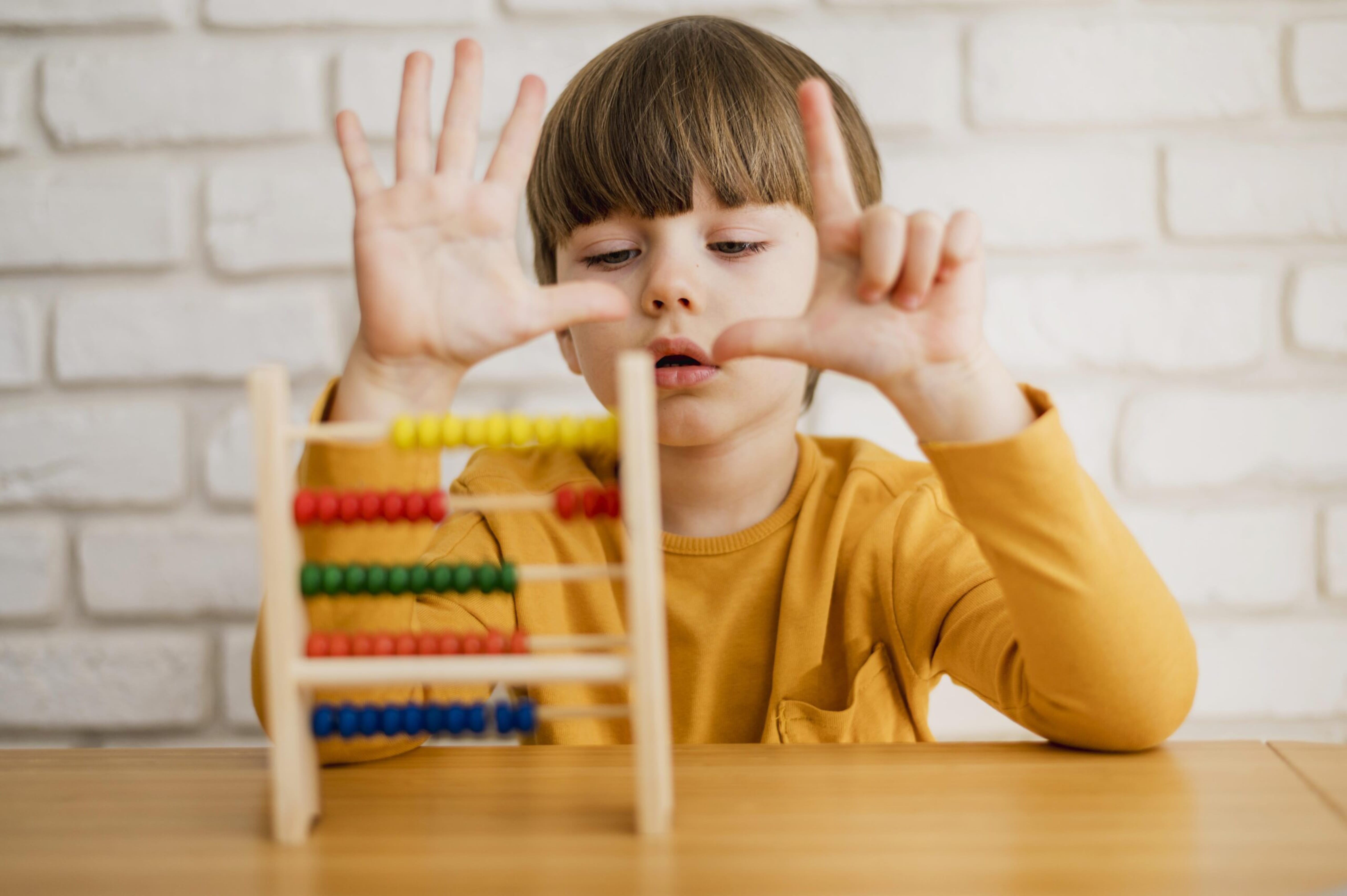 Child counting using a montessori resource