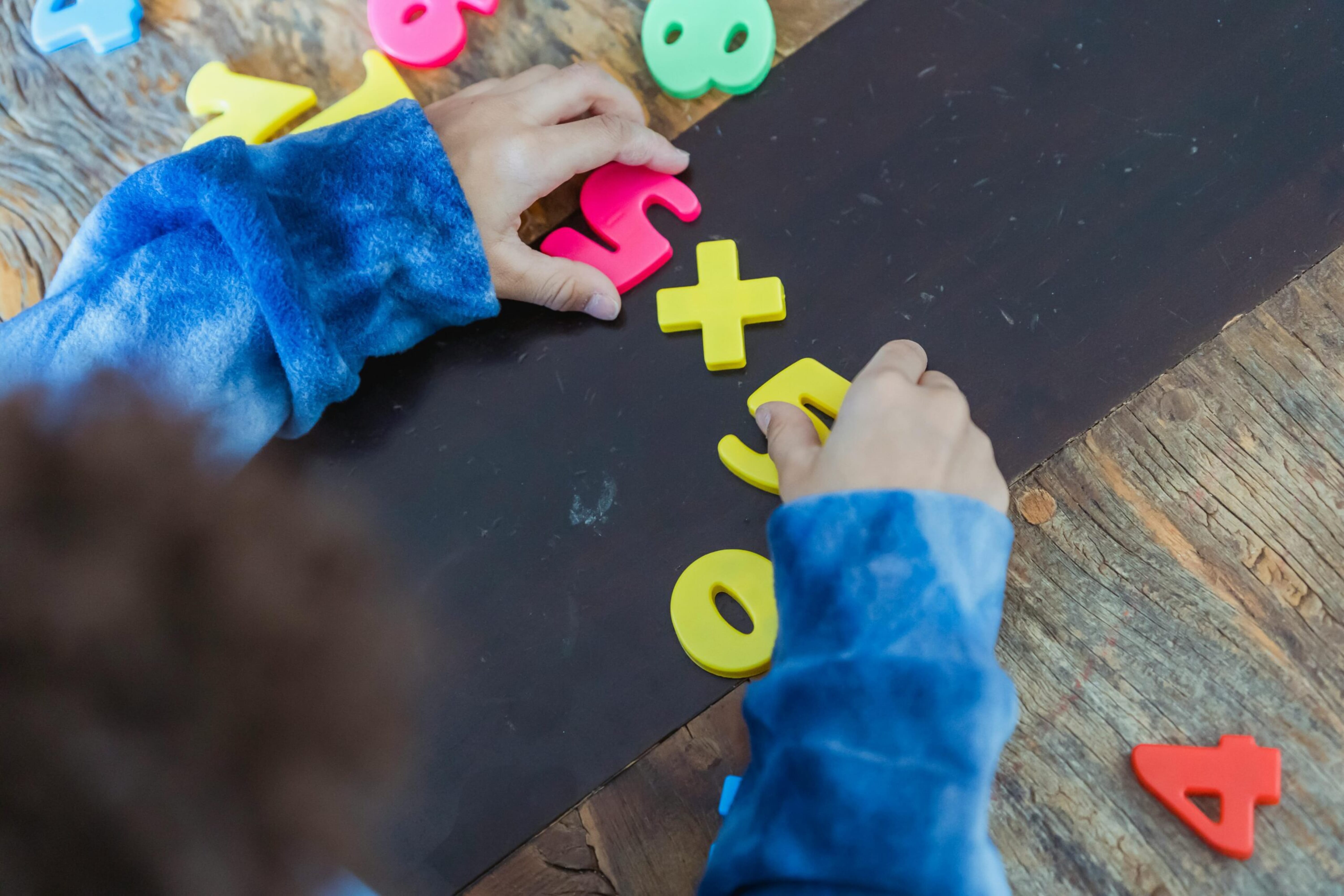 Child sorting gnumber resources to re-inforce counting