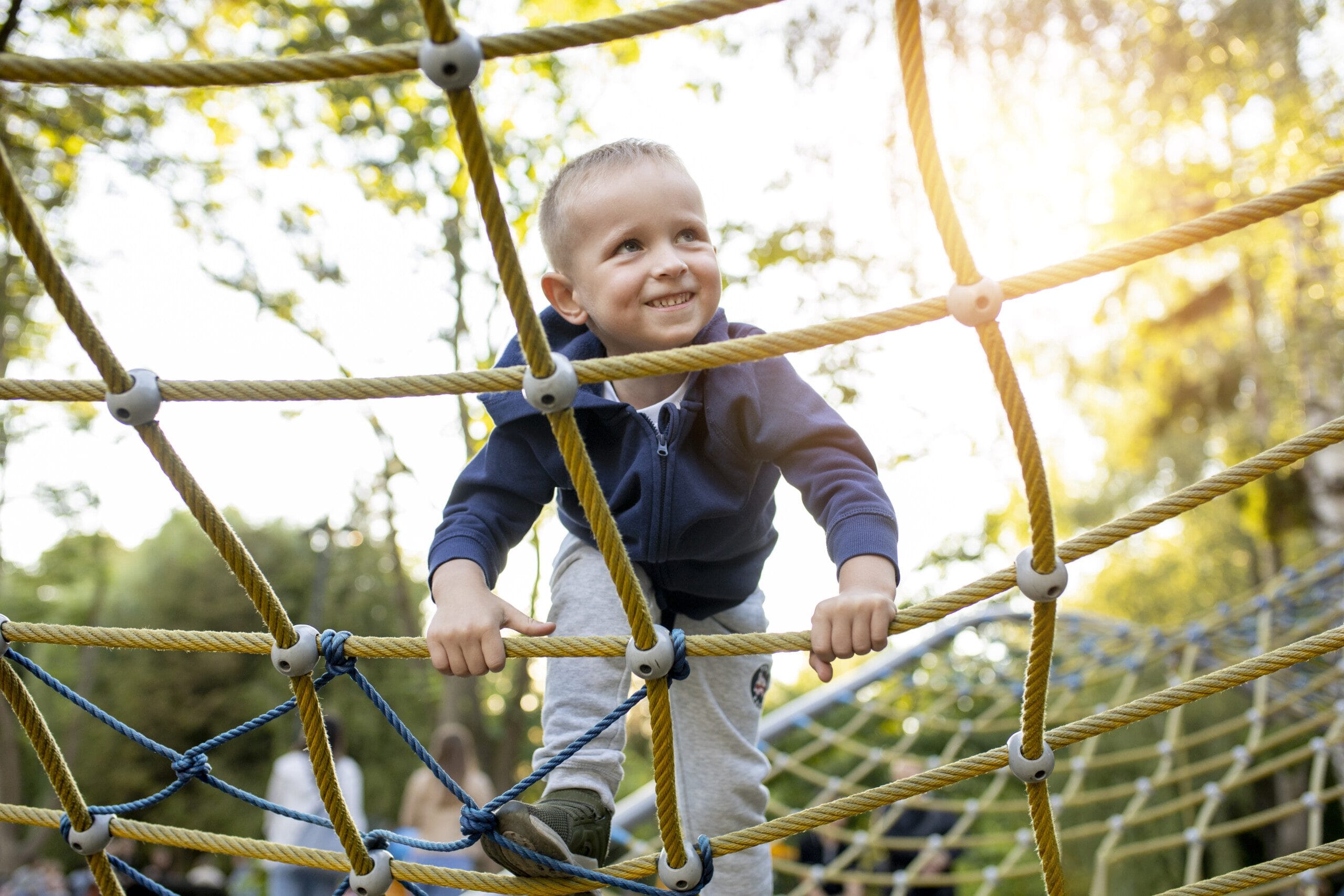 Child climbing up apparatus at a local park