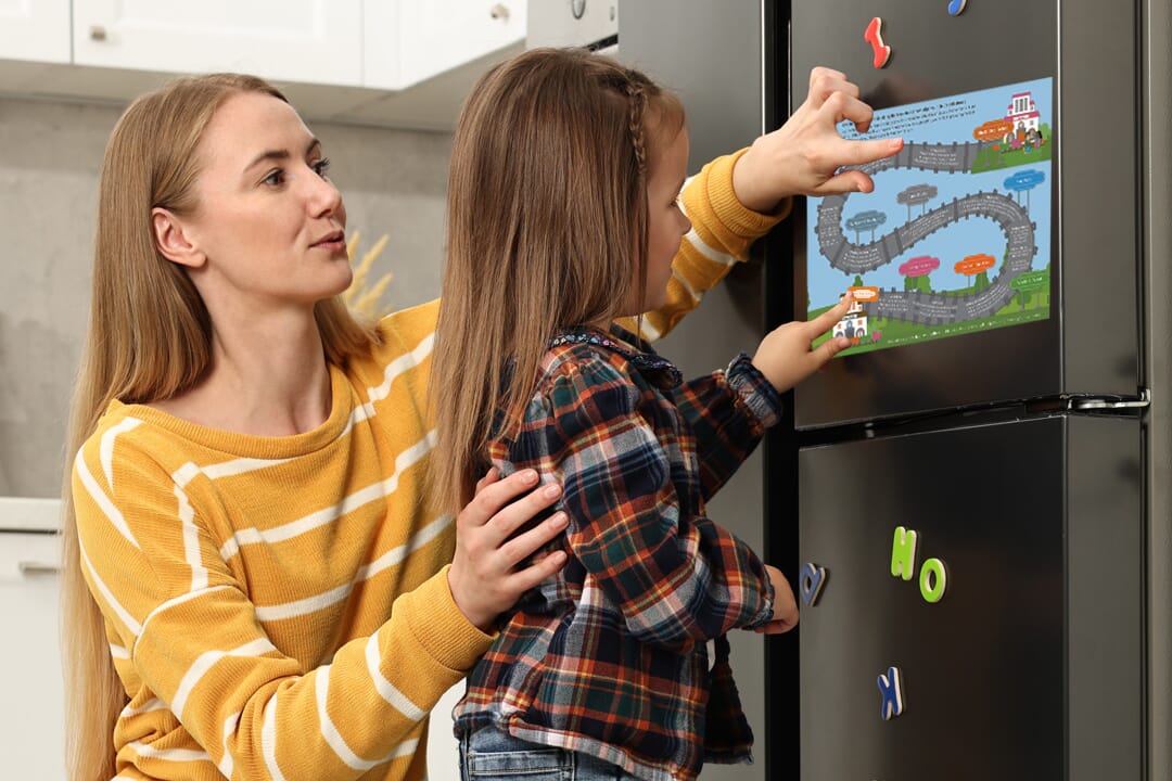 Mother and child at fridge with NSS tracker (zoomed in)