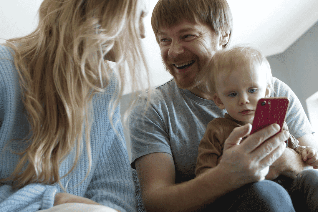 TOSN App - family looking at phone