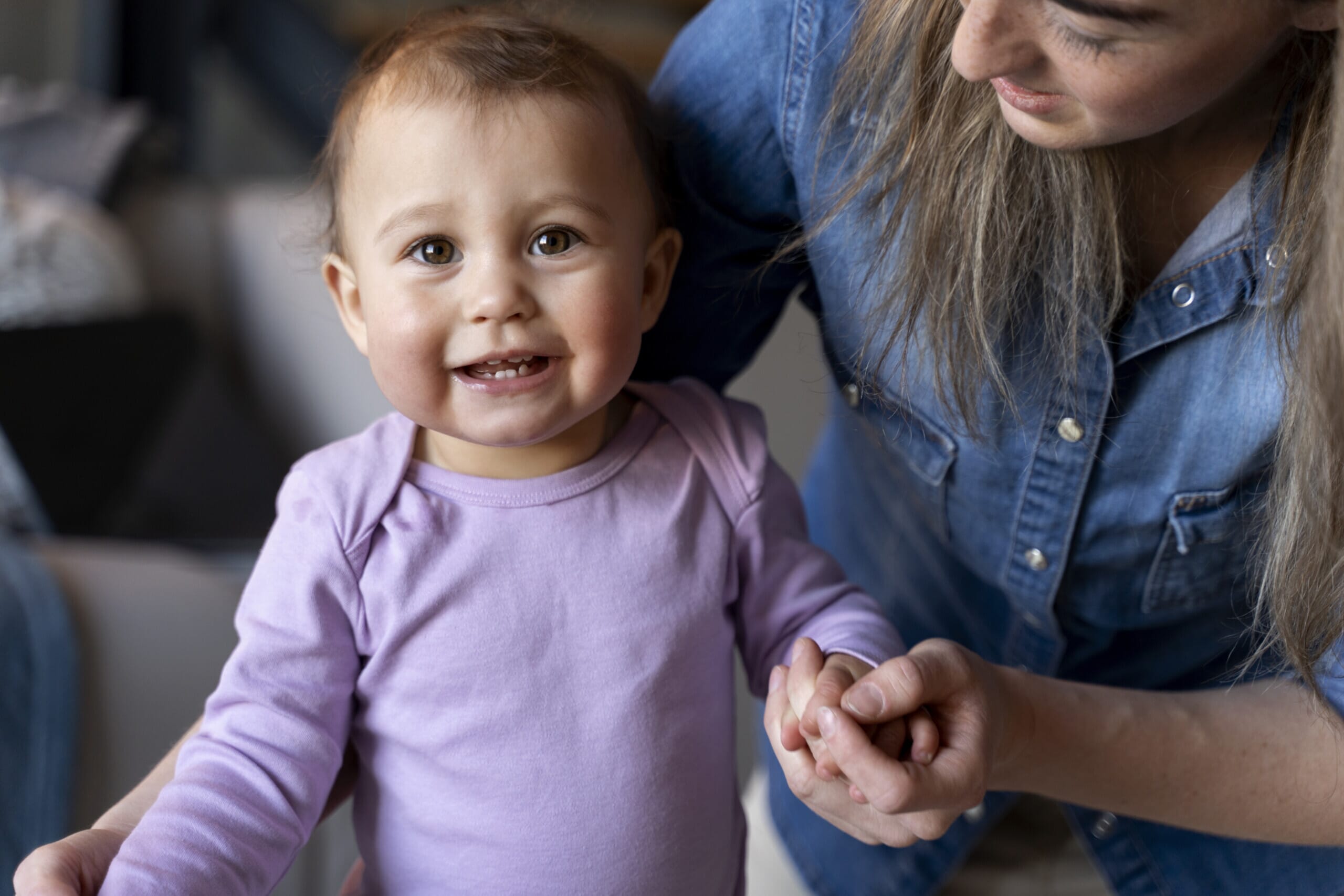 Baby walking with practitioner