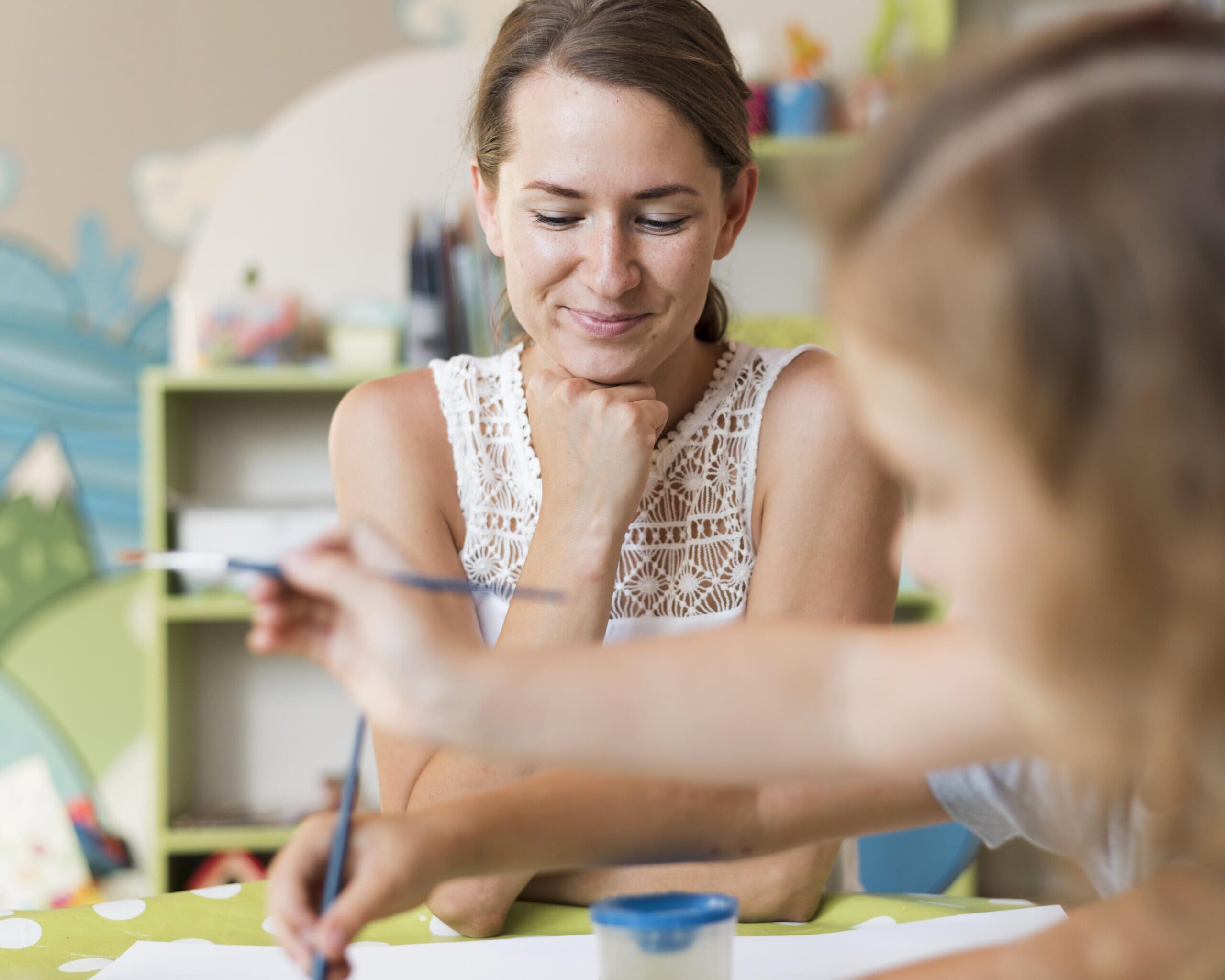 close-up-teacher-girl-table