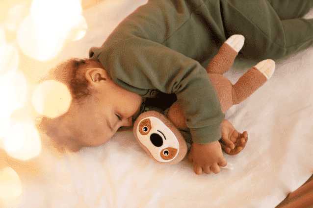 Child sleeping with teddy